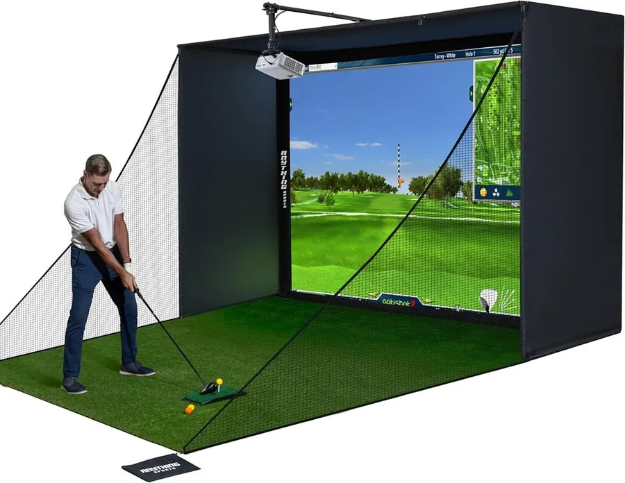 Complete golf simulator enclosure with 4K-ready impact screen and blackout cage in a garage
