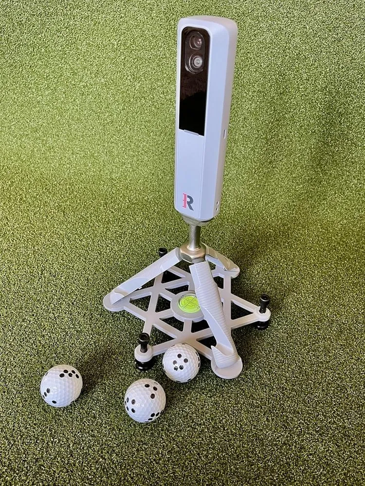 Compact leveling stand raising a Rapsodo MLM2PRO to the correct height