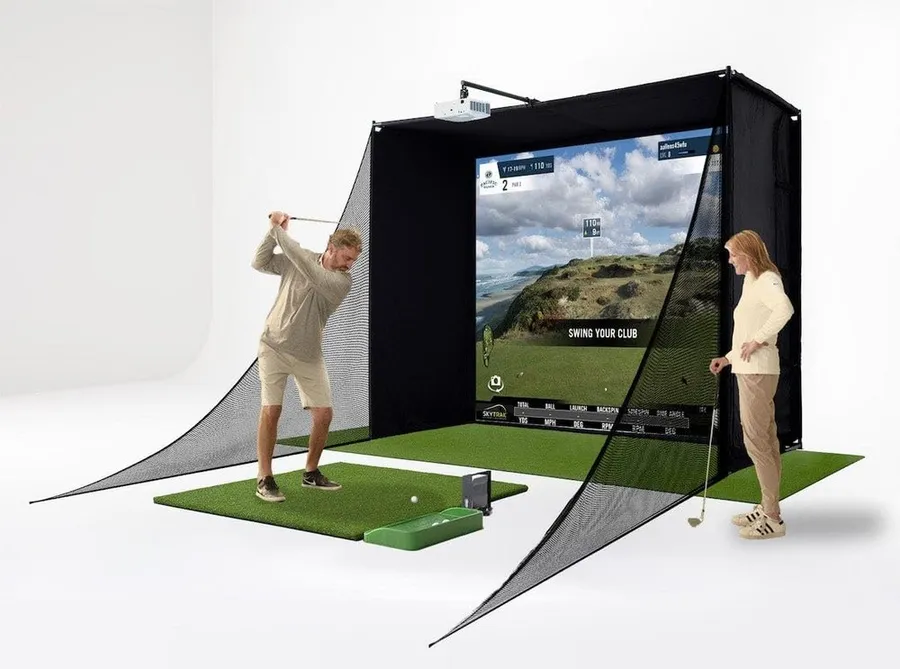 SkyTrak Studio Pro golf simulator package with launch monitor, enclosure and mat